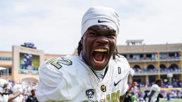 Travis Hunter celebrates on the field after win over TCU